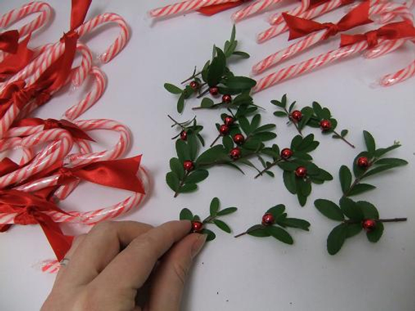 Glue a few shiny red beads to a snipped of boxwood