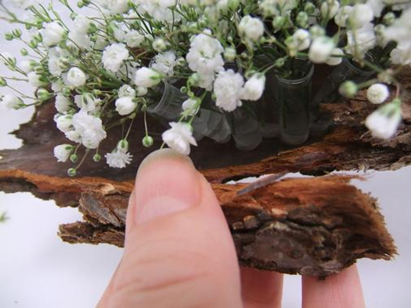 Glue bits of bark to the side of the "log" to hide the mechanics 