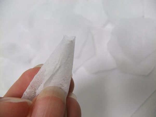 Roll the first two petals to shape the bud