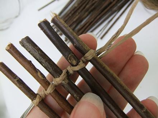 Continue binding twigs to the circle