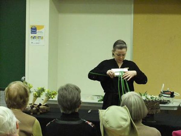 Demonstrating how to weave