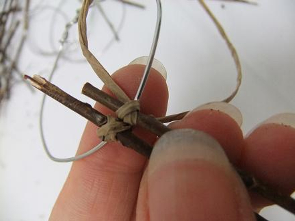 Fold the other wire from under the wire and over to the back