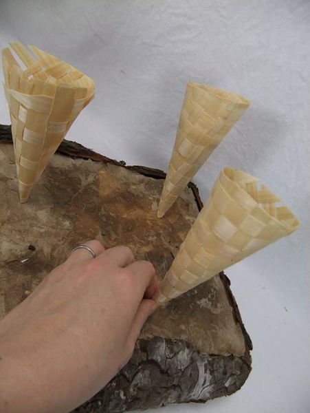 Shaved wood cones standing upright on the stand
