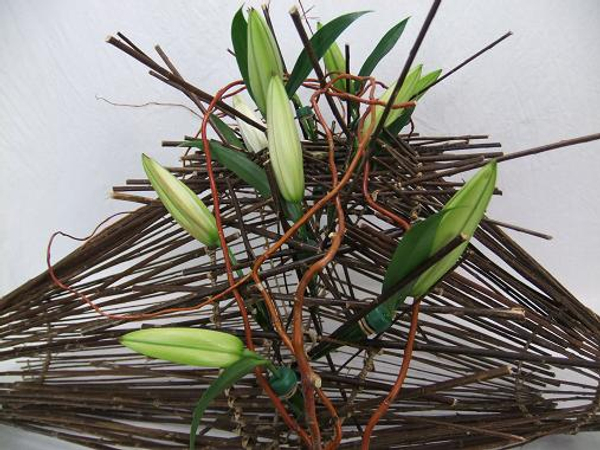 The loosely suspended twigs form a supportive unit resting on the wired funnel foundation