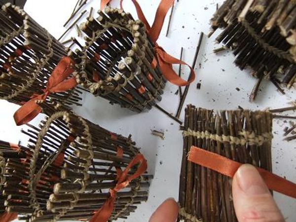 Weaving ribbon through the twig cupcake liners