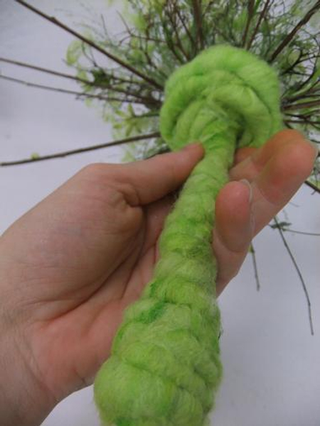 Cover the stem and coil the wire to from a flat base at the base of the dried flower head.