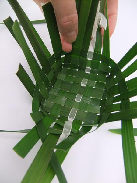 Fold up the ribbon and weave it as you do the foliage.