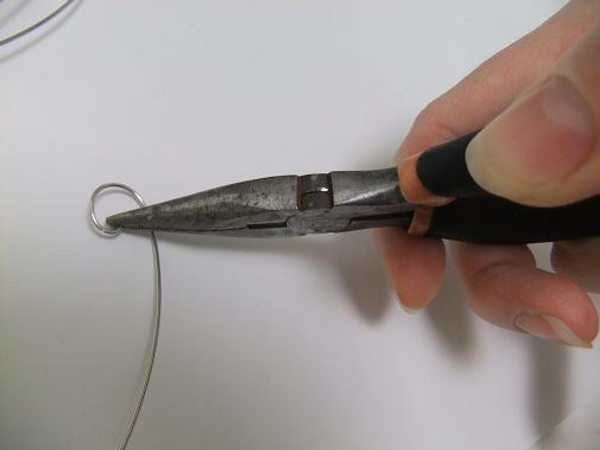 Curl the end of the wire with pliers.