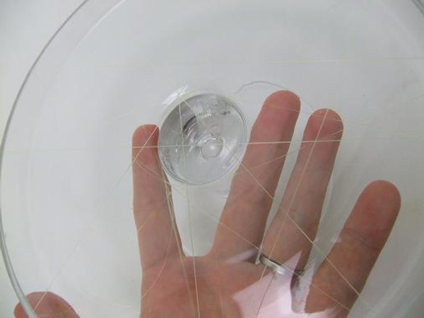 You now have a web of line over the shallow container You now have a web of line over the shallow container