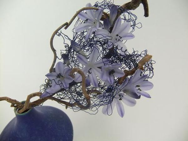 Blue Agapanthus nestled in a wire heart armature