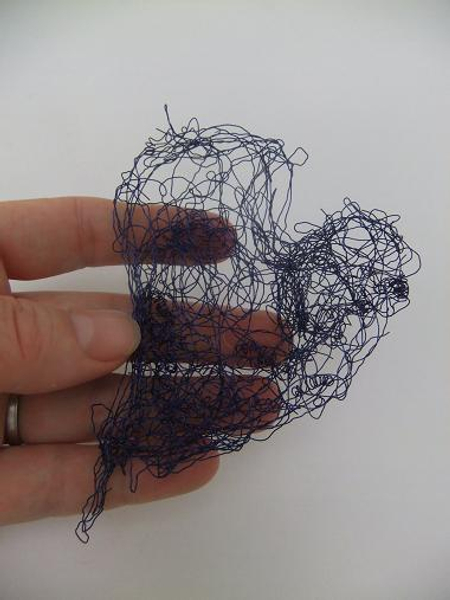 Pull the wire into a heart shape.