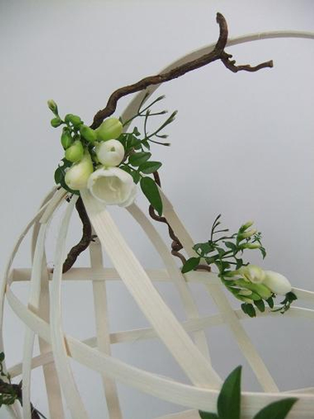 Freesia, jasmine and hazel decorate the basket