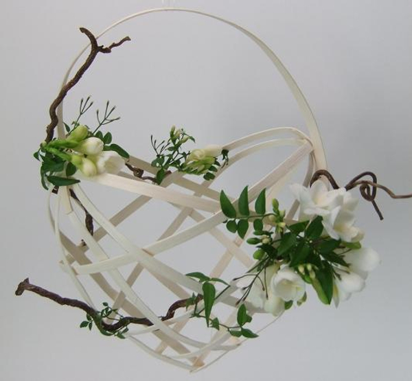 Midelino Cane basket with freesia and jasmine