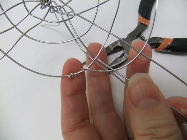 Cut the wire short and twist to secure