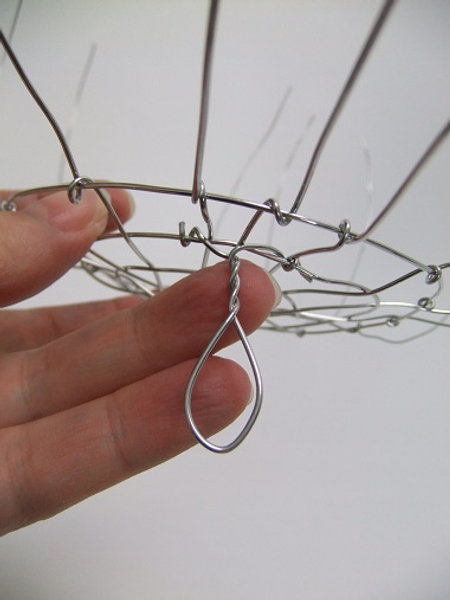 Twist the wires to the bottom of the wire armature.