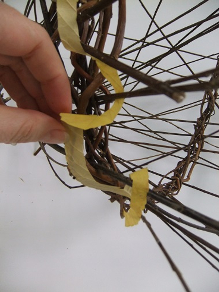 Gently wrap the leaf swirl around the wreath