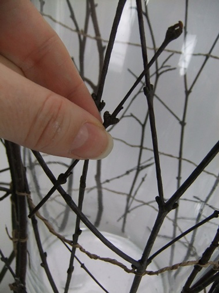 Cut and glue some smaller twigs to the armature to break up the stick pattern.