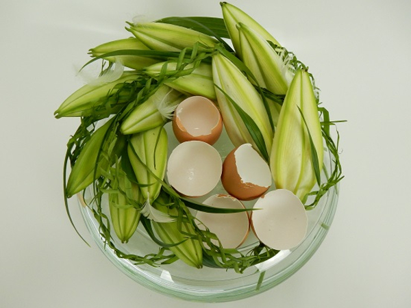 Easter lilies and palm leave garlands.