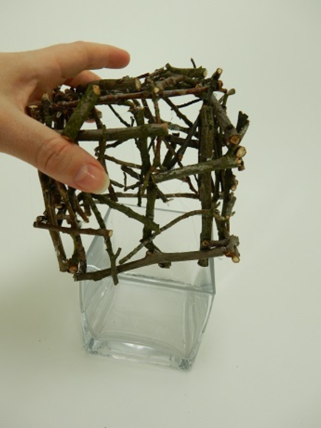 Slide the twig square over the cube vase.
