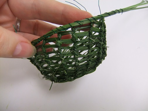 Work your way around the basket securing the strands and the wire