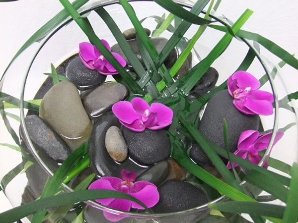 Pebbles, grass and butterfly orchids