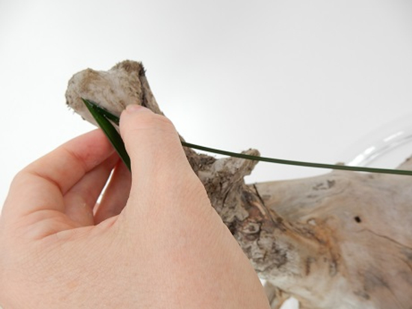 Glue another blade of grass to the top of the driftwood