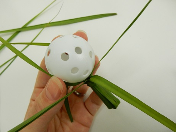 Place a small plastic ball to rest on the test tube opening