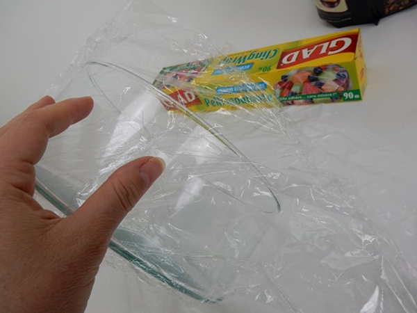Cover the outside of the glass container with cling film