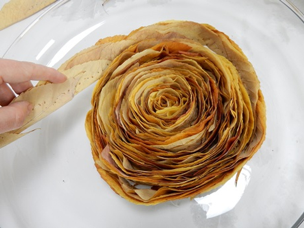 Continue to wrap the leaf garland around the swirl Continue to wrap the leaf garland around the swirl