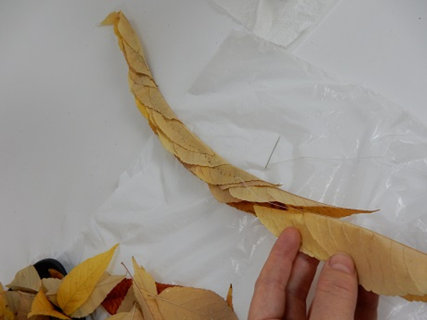 Keep nestling in leaves and stitching them together to create a long garland