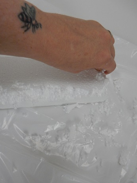 Move around the Styrofoam and pinch away the neat sharp edge.