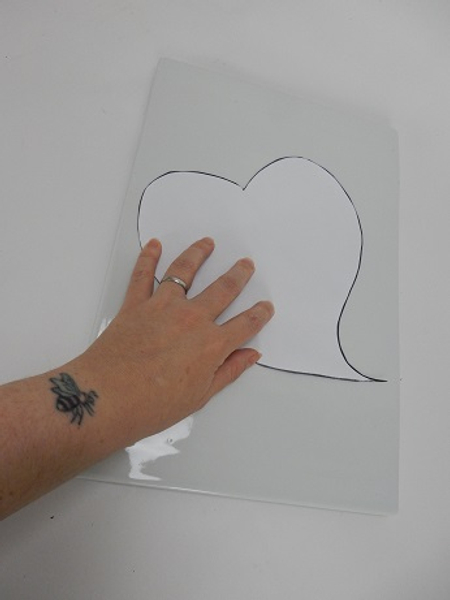 Place the heart shape template on a flat display surface