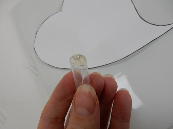 Seal the cut straw with hot glue