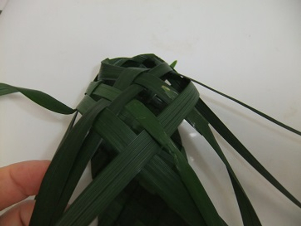 Fold each leaf up and weave through