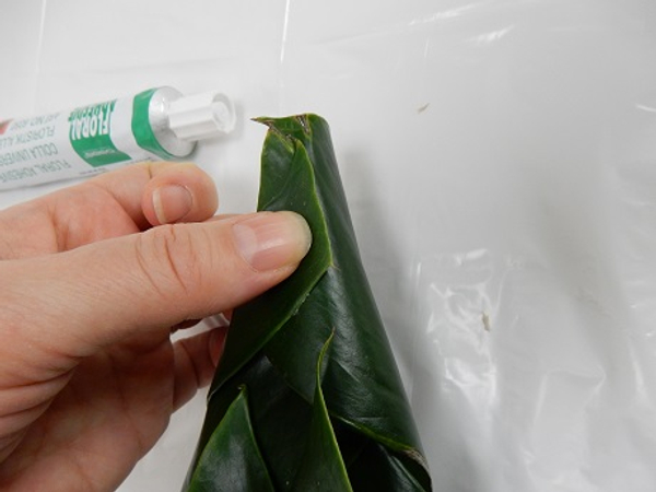 Roll the leaf tip and secure with a drop of glue
