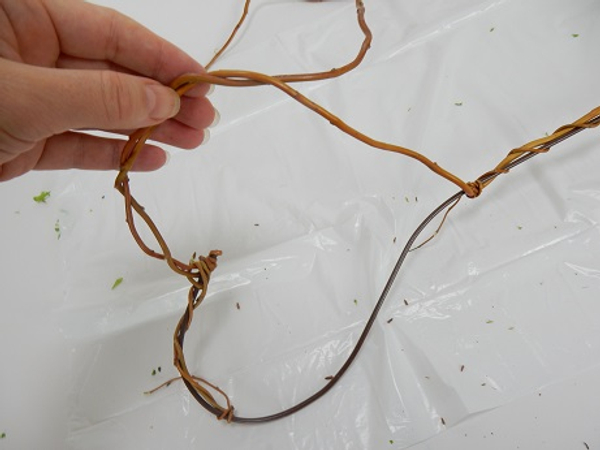 Weave the rest of the willow stem to wrap around the other side of the heart
