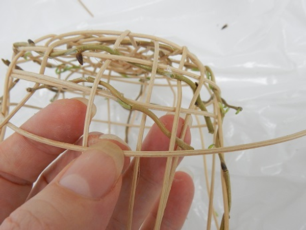 Continue the over and under weaving pattern up the sides of the nest