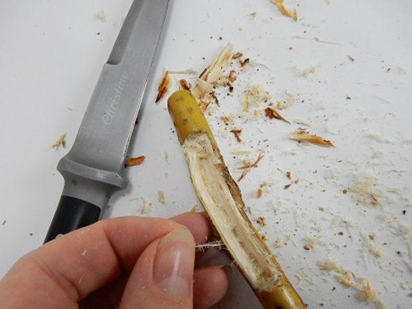 Chip away at the wood with your knife or wood tools