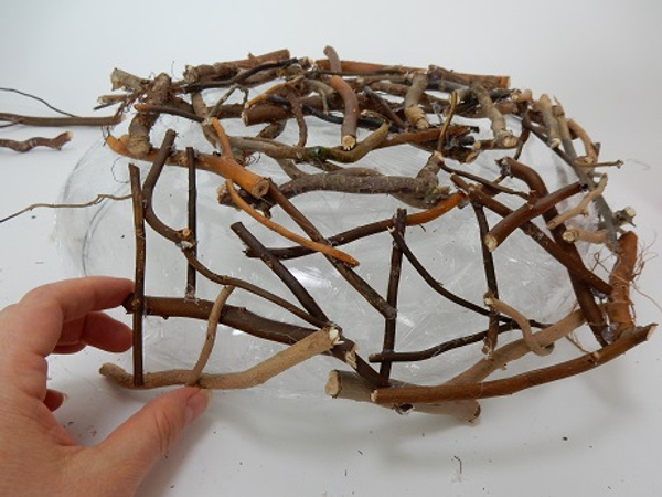 Add thicker twigs to create the rim