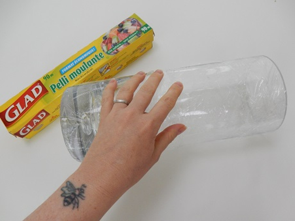 Cover a cylindrical vase with cling wrap