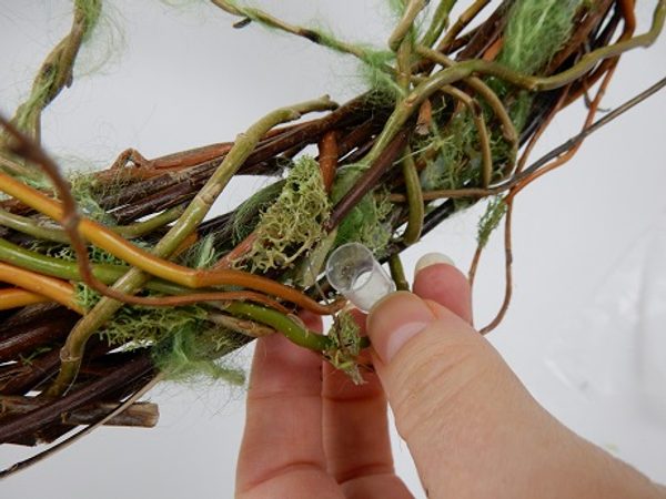 Place tiny test tubes as a water source for the fresh flowers