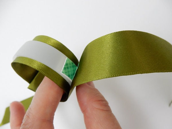 Leaving some ribbon to dangle loosely Leaving some ribbon to dangle loosely