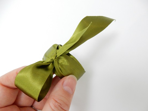 Tie the ribbon ends in a decorative knot or bow