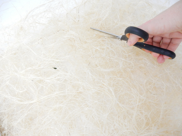 Cut a disk shape in the sisal to create a frame for the focal point