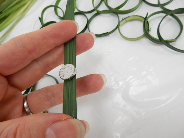 Glue a small but heavy magnet to a blade of grass