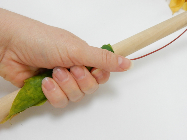 Glue the leaf with a small drop of floral adhesive
