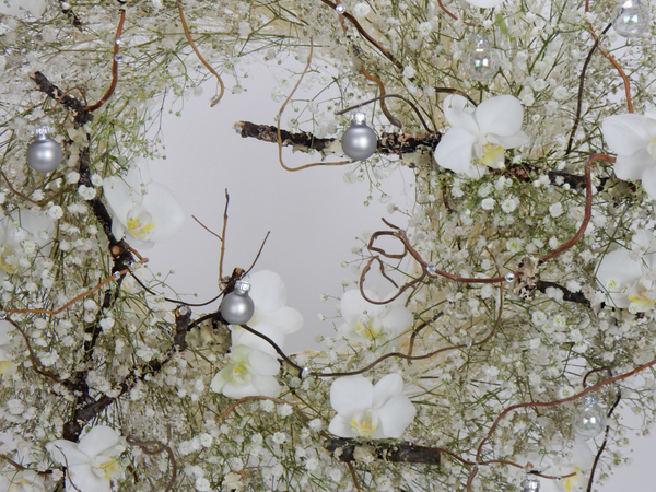 Silver baubles in a winter white wreath