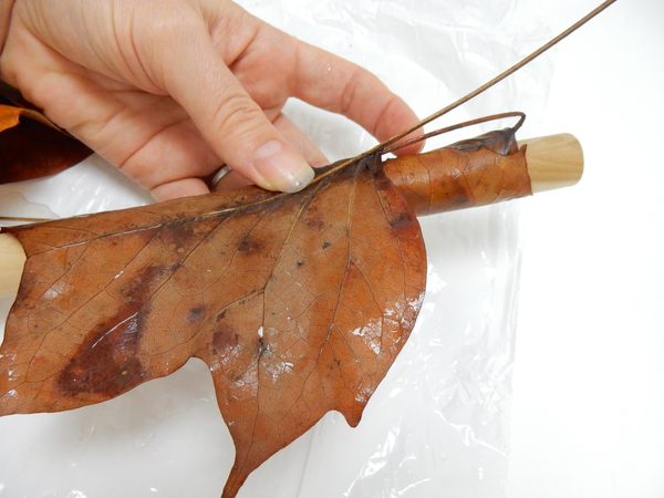 Wrap the next leaf to hold the previous one in place