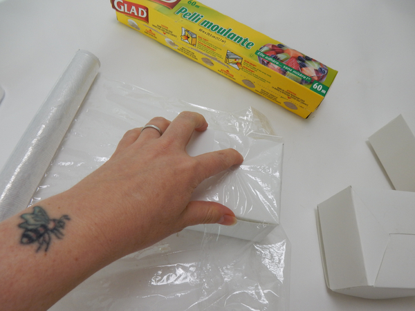 Cover the boxes with cling film