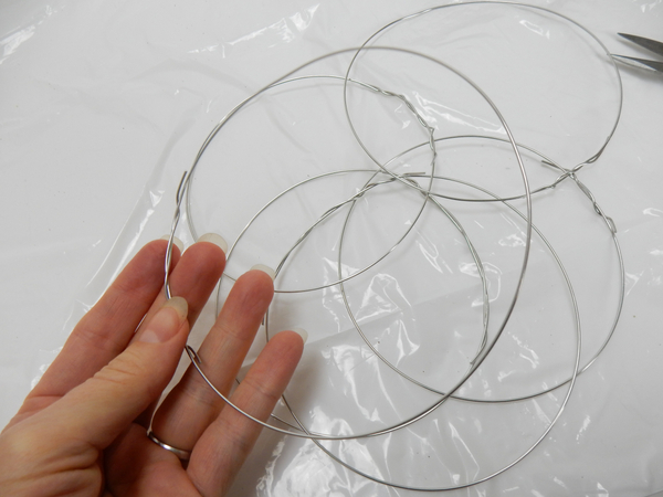 I prefer to make a few rings and then assemble the ball shape
